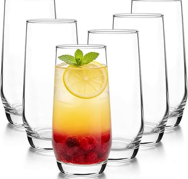 Set of six highball glasses featuring a cocktail with fresh berries, lemon, and mint.