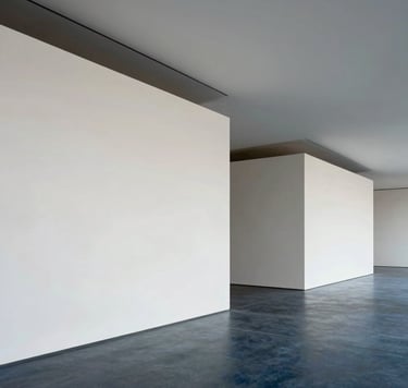 A refined architectural photograph of a modern art gallery interior, featuring minimalist clean lines in crisp off-white and muted ocean grey, with soft light casting deep slate blue shadows across the floor.