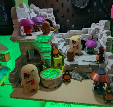 Castle Shrooman including an ancient well used to enter the Shrooman domain. Examples of miniatures.