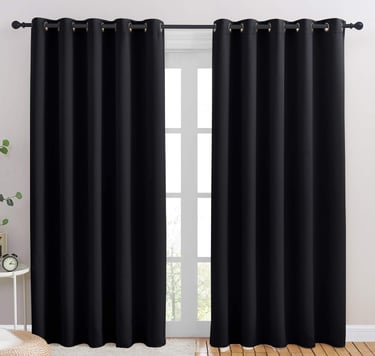 a black curtain with a white curtain and a window