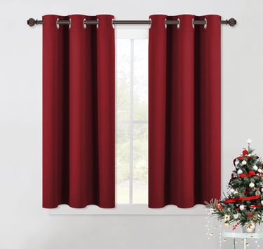 a christmas tree with a red curtain and a christmas tree