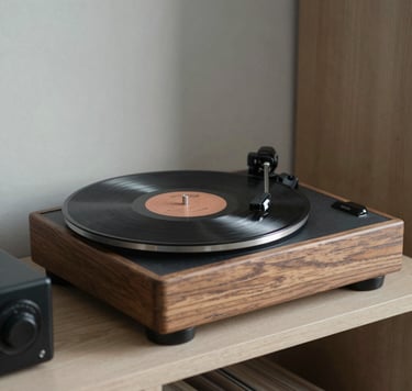 A thoughtful photography composition featuring a vintage record player and a vinyl disc on a minimal shelving unit. Soft focus on the natural grain of the wood. International / Western interior setting. Professional and curated aesthetic. Colors include Warm Grey and Dark Grey.