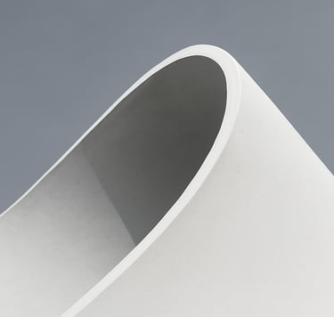 Editorial photography, close-up of a white architectural curve against a soft gray sky, high-contrast, minimalist composition, sharp focus and clean lines. Global / Contemporary Art.
