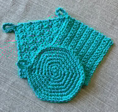 One round and two square aqua crocheted face scrubbies
