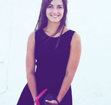 a woman in a black dress and a black jacket