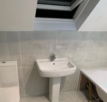 new toilet and sink fitted in a bathroom in worcester