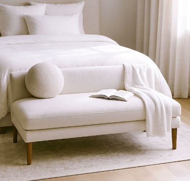 Compact linen settee in a cozy reading corner with natural shadows, a book, and a warm light atmosphere.