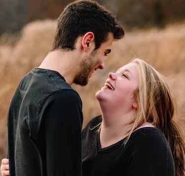 Young couple smiling at each other
