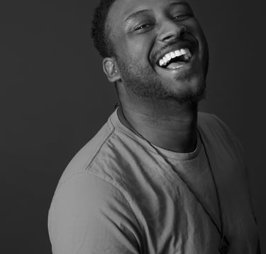 edwin bodney LA based spoken word poet laughs in black and white photo
