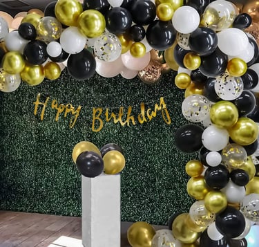 a birthday party with balloons and balloons