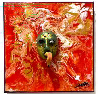 un visage sculpté vert avec une longue langue qui émerge d'un tableau rouge