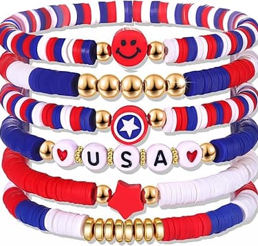 Stacked red white and blue patriotic clay bead bracelets with USA charms and gold accents.