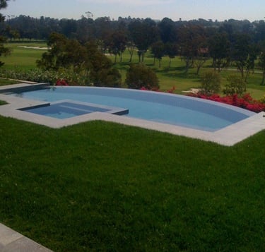 vanishing edge swimming pool overlooking golf course