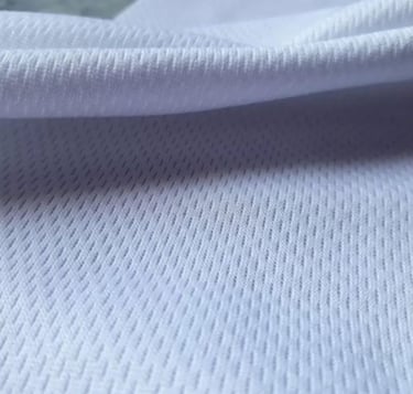 a white shirt with a black and white background