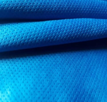a close up of a blue fabric covered fabric