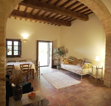 a living room with a couch and an arc