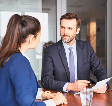 nfl football jobs employee conducting a resume review with potential job candidate