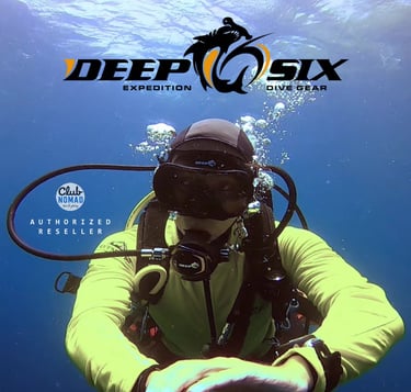 a man in a yellow jacket with Deep 6 scuba diving mask
