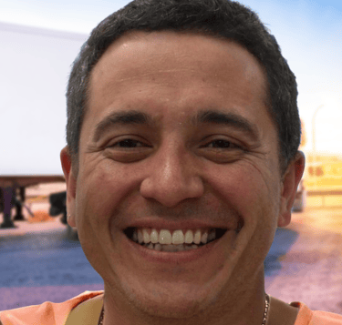 a man with a necklace on his neck