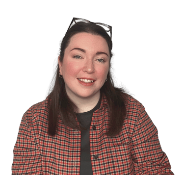 A women (Erin, owner of EB Socials) with brown hair and an orange checked shirt, smiling at the camera