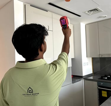 An engineer is using thermal camera to inspect leak in an apartment