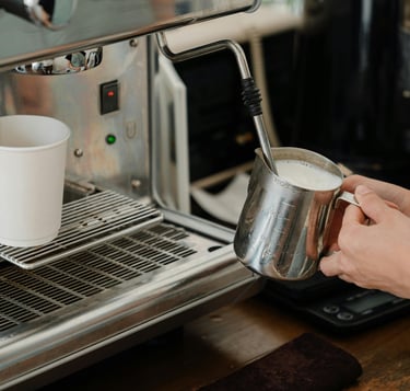 milk stainless steel pitcher while using milk frother