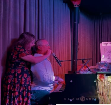 Karey Nickel includes an audience member at a dueling pianos show