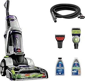 Bissell ProHeat 2X Revolution Pet Pro upright carpet cleaner with attachments and cleaning formula bottles.