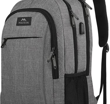 Grey Matein travel laptop backpack with USB charging port and multiple anti-theft zipper compartments.