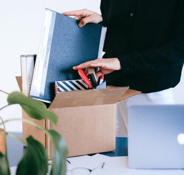 Wrongfully terminated employee leaving office after unfairly fired in Los Angeles