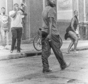 a man and woman dancing in the street with trompet player on the side