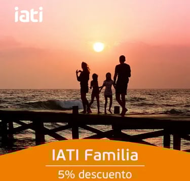 Silhouette of a family on a pier at sunset promoting IATI Familia travel insurance.