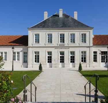 mairie champniers a large white building with a long walkway