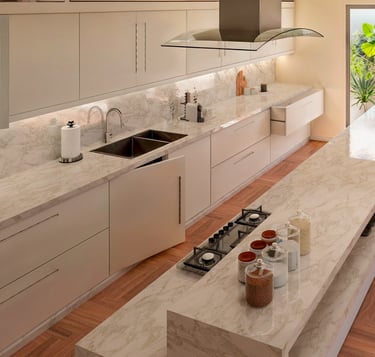 Modern luxury kitchen featuring white marble countertops, a large island with seating, and sleek minimalist cabinetry.