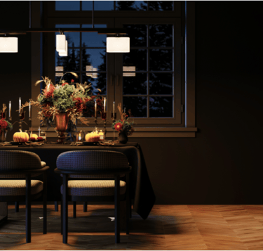 A festive dinner scene with a focus on the table decorations and with a window in the background.