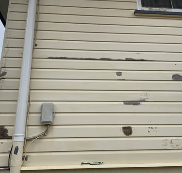 Before exterior painting in Zillmere showing peeling paint on weatherboards