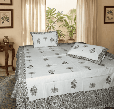 Sanganeri style hand-block printed bedsheet with pink floral and green palm motifs