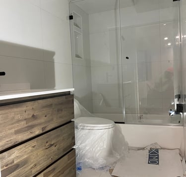 a bathroom with a toilet and a toilet paper roll