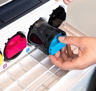 Woman loading printer toner