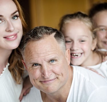 a man and two children posing for a family photoshooting