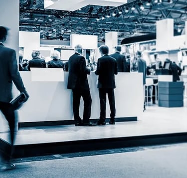 A B2B exhibition space with with business professionals networking