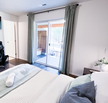 a bedroom with a desk and a chair