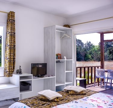 Bed with full bedding, floating bed with swimming pool view, olive grove view and garden at Domaine Des Lucques