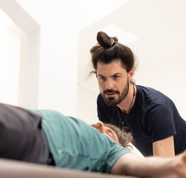 Practitioner joyfully focused on the client breathing and communicating through words and touch