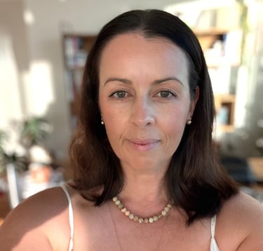 Portrait of a Brisbane-based photographer and content creator in a natural indoor setting