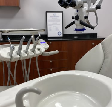 a dental room with a sink and a microscope