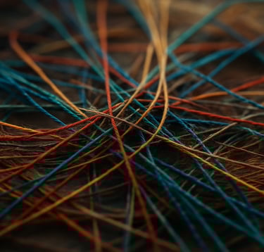 InnerLoom Life Coaching: colorful woven threads symbolizing connection clarity and growth