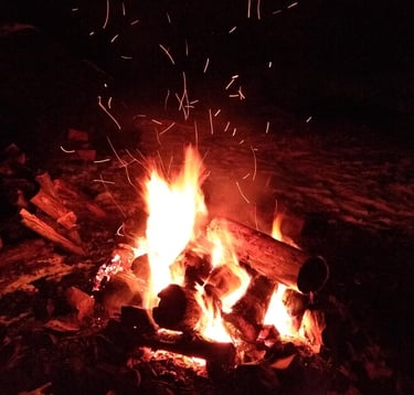 a fire pit with a fire in the middle of it