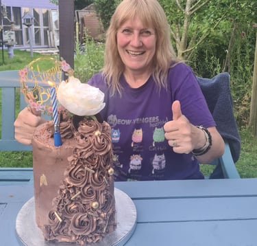 Patsy in our garden with a birthday cake