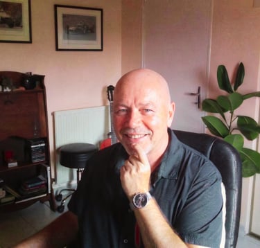Nigel John Farmer in his home office in South West France, 2026.